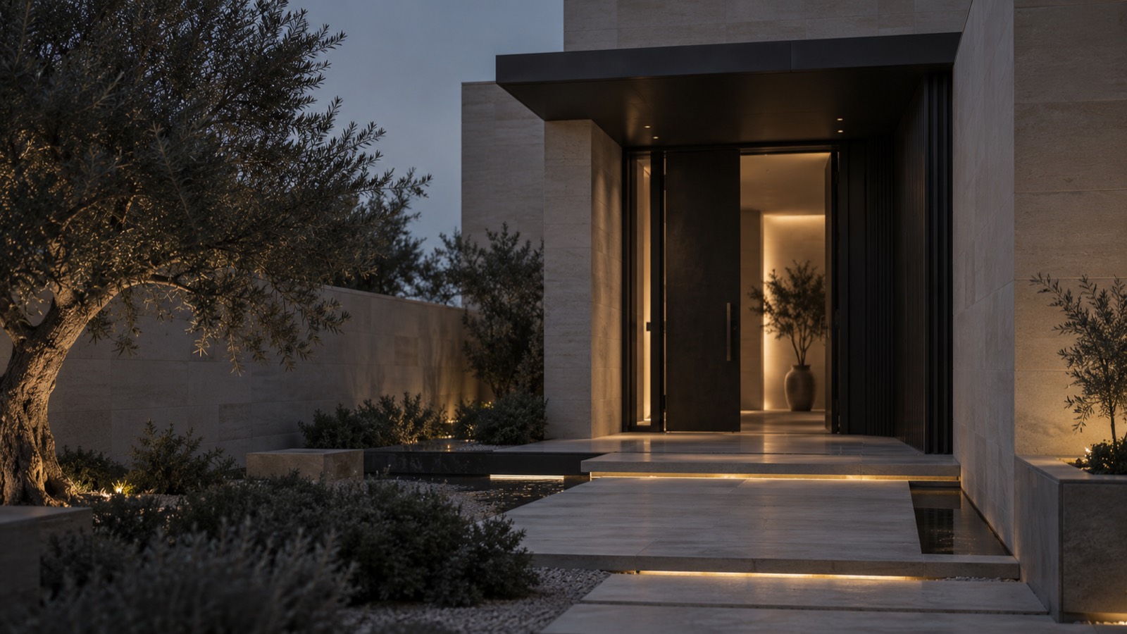 A quiet residential entrance at dusk, stone and shadow